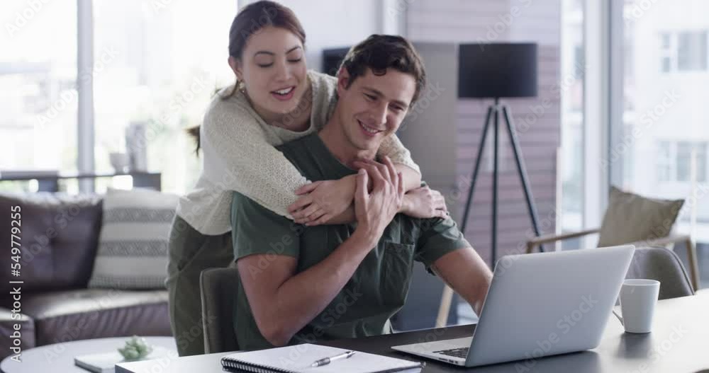 Laptop, couple and love hug in home with husband, freelancer or remote worker working at desk or table. Romance, affection and happy woman hugging or embrace man on computer in living room of house. Laptop, couple and love hug in home with husband, freelancer or remote worker working at desk or table. Romance, affection and happy woman hugging or embrace man on computer in living room of house.