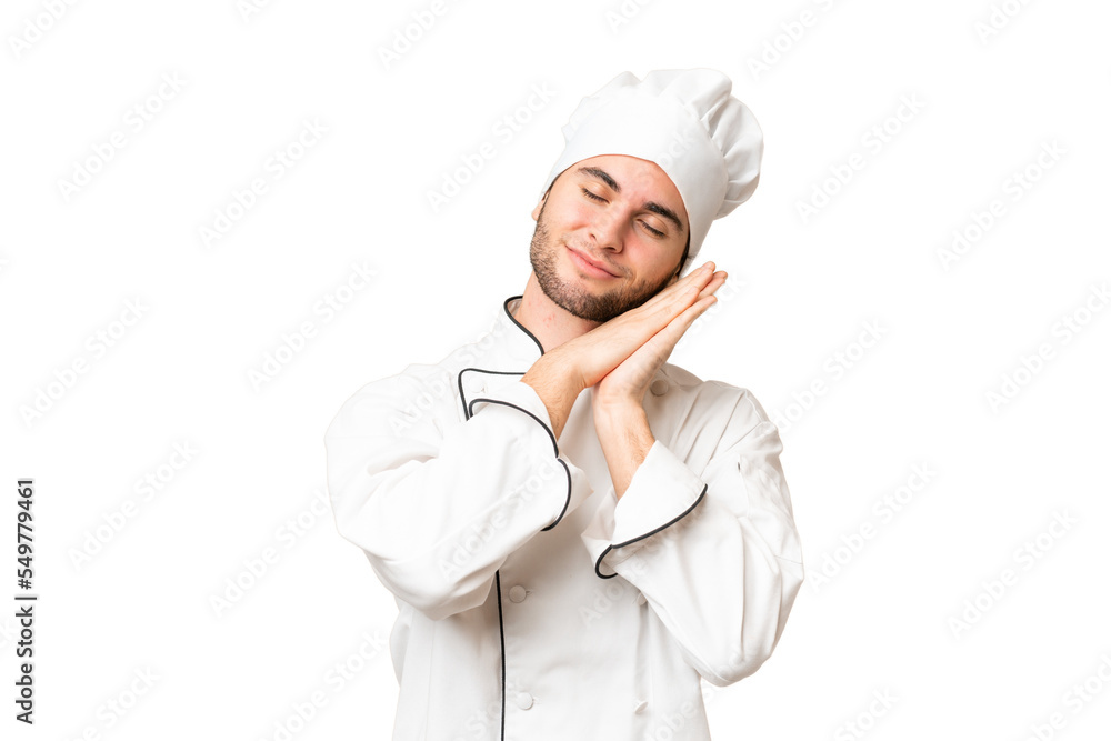 Young handsome chef man over isolated background making sleep gesture in dorable expression Young handsome chef man over isolated background making sleep gesture in dorable expression