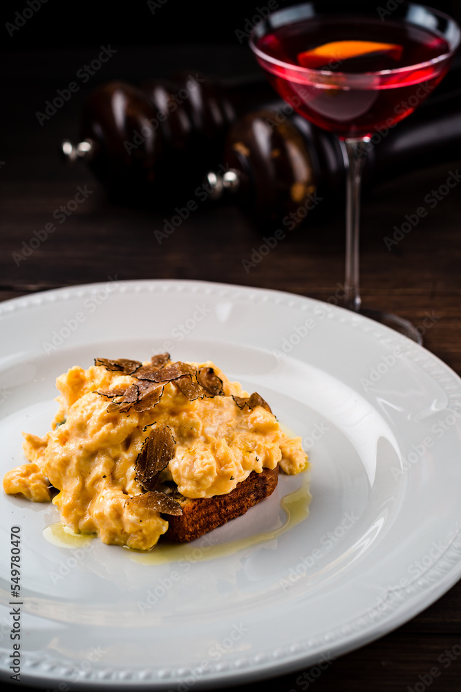 Breakfast rye bread toast with fried scrambled egg and onions. Breakfast rye bread toast with fried scrambled egg and onions.