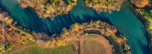 Aerial view of the Sile river at S. Elena di Silea (Treviso, Italy) at sunrise in autumn