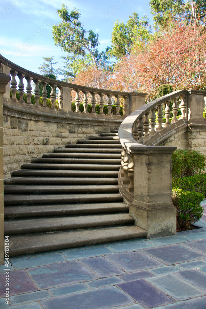 stone balustrade outlines the grand staircase leading to the courtyard