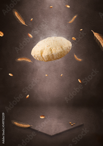 Indian Traditional Cuisine Chapati The Phooli (Air filled) Roti, Fulka flying, Indian Bread, Flatbread, Whole Wheat Flat Bread, Chapati. On dark textured background. photo