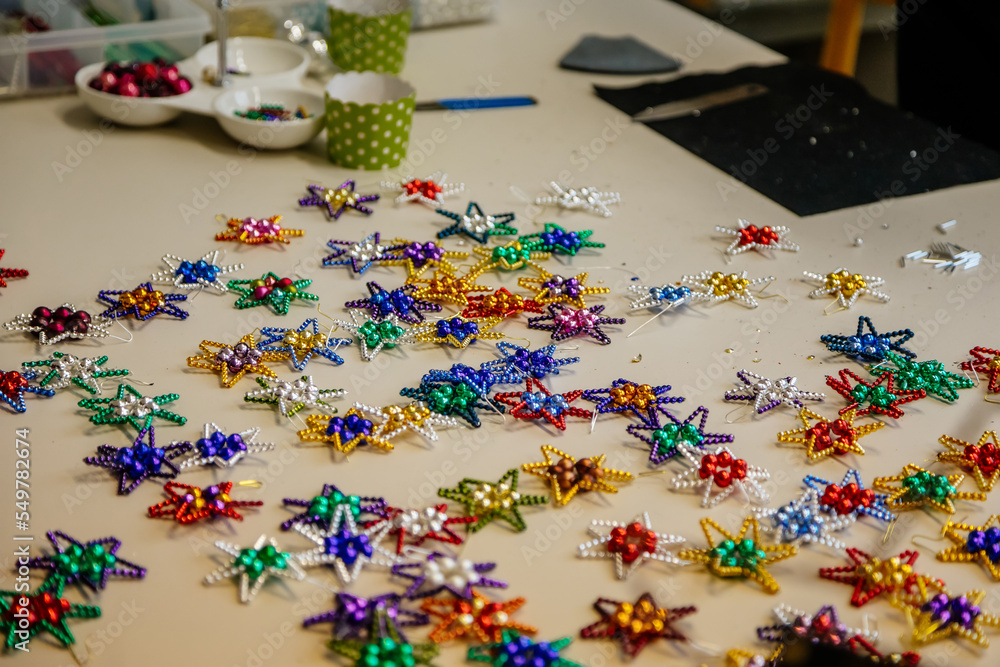 Ponikla, Czech Republic, 31 December 2021: Glass bead vintage ornaments and figurines hand-manufacturing, traditional production of Christmas and New Year decorations, decorative hand painted