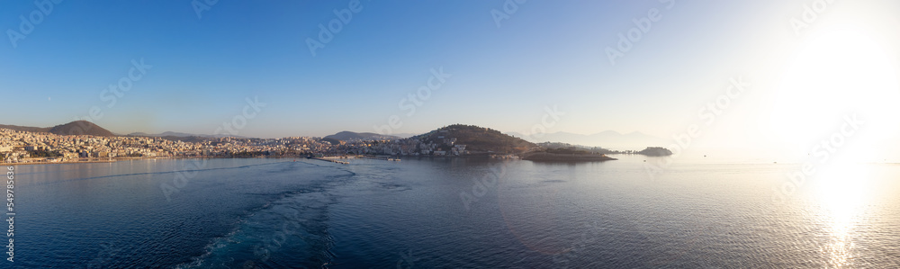 Homes and Buildings in a Touristic Town by the Aegean Sea. Kusadasi, Turkey. Sunny Morning Sunset. Panoramic Aerial View from Cruise Ship