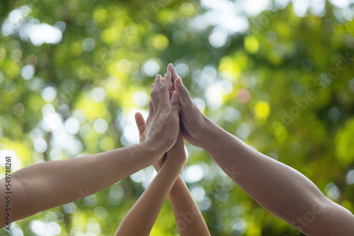 Canvas Print Motivated business team join hands palms together, giving high five