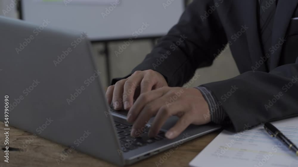 Mature middle aged businessman working on laptop computer in office Man typing on keyboard and searching for new job on internet at coffee shop business idea Mature middle aged businessman working on laptop computer in office Man typing on keyboard and searching for new job on internet at coffee shop business idea