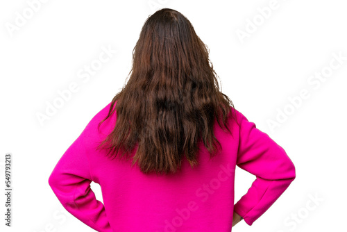Young caucasian woman isolated over isolated background in back position