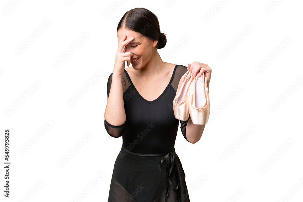Young caucasian woman practicing ballet over isolated background laughing Young caucasian woman practicing ballet over isolated background laughing