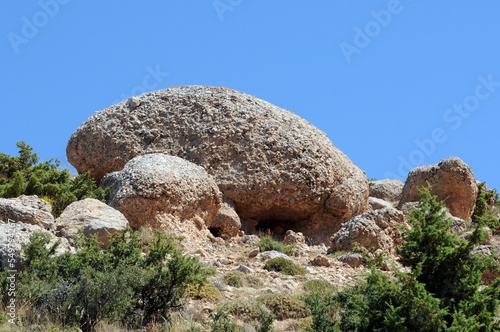 Conglomerate rock formations rounded by wind erosion in Emli Valley in Aladağlar National Park in Niğde Province in Turkey. photo