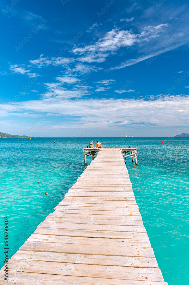 Wooden jetty at emerald Mediterranean sea - 7117