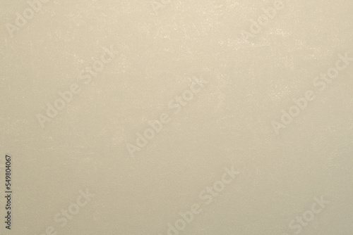 Panorama de fond uni en papier beige pastel pour création d'arrière plan.