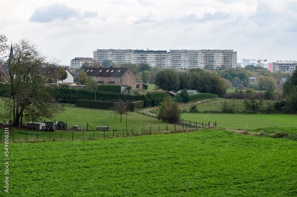 Zellik, Flemish Brabant Region, Belgium - View over the green hills and the urbanisation of the village Zellik, Flemish Brabant Region, Belgium - View over the green hills and the urbanisation of the village