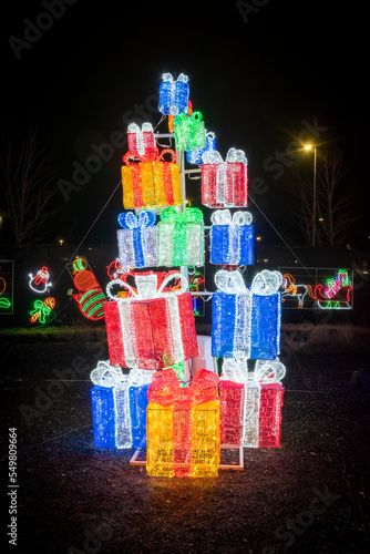 A stack of Christmas presents made out of different colours of lights is on display outdoors at the Illumi Light Festival in Mississauga, Ontario. © John