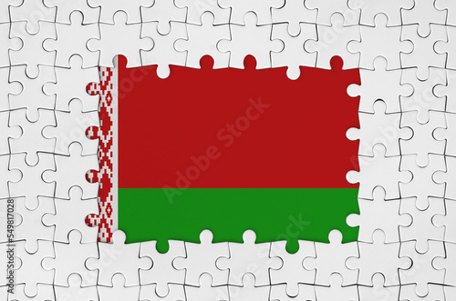 Belarus flag in frame of white puzzle pieces with missing central part photo