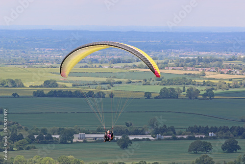 Tandem Paraglider flying from Combe Gibbet, England
