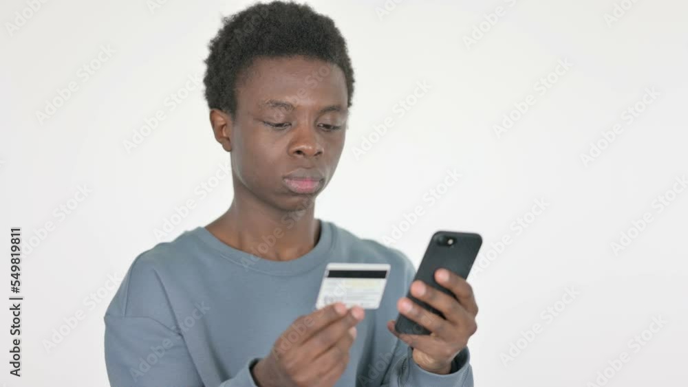 Young African Man Shopping Online on White Background Young African Man Shopping Online on White Background