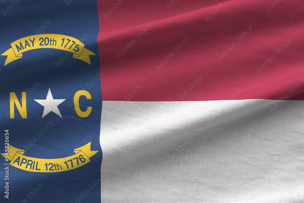 North Carolina US state flag with big folds waving close up under the ...