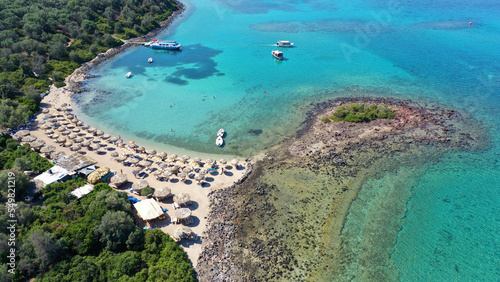 Aerial drone photo of tropical exotic paradise volcanic island complex bay with deep turquoise sea forming a blue lagoon archipelago visited by luxury yachts and sail boats © aerial-drone