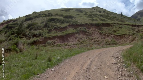 Song-Kul, Kyrgyzstan - May 2022: Point of View driving hyper lapse in 33 Parrots road, a zig zag route climbing towards Song-Kul Lake. Route and nature, travel concept dashcam POV in Kyrgyzstan photo