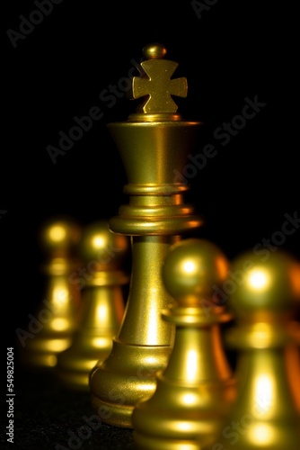 golden chess piece king on a black background