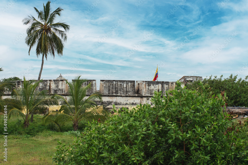historic fort of san fernando de bocachica surrounded by beautiful green vegetation and palm trees on bocachica island historic fort of san fernando de bocachica surrounded by beautiful green vegetation and palm trees on bocachica island