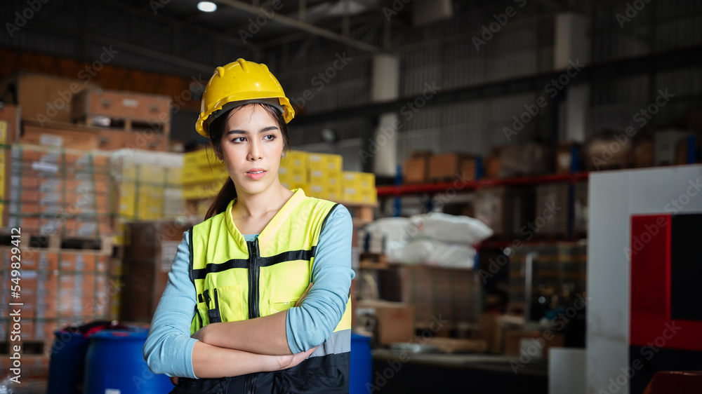 Portrait of a Happy warehouse worker in a warehouse or storehouse while looking at camera. Portrait of a Happy warehouse worker in a warehouse or storehouse while looking at camera.