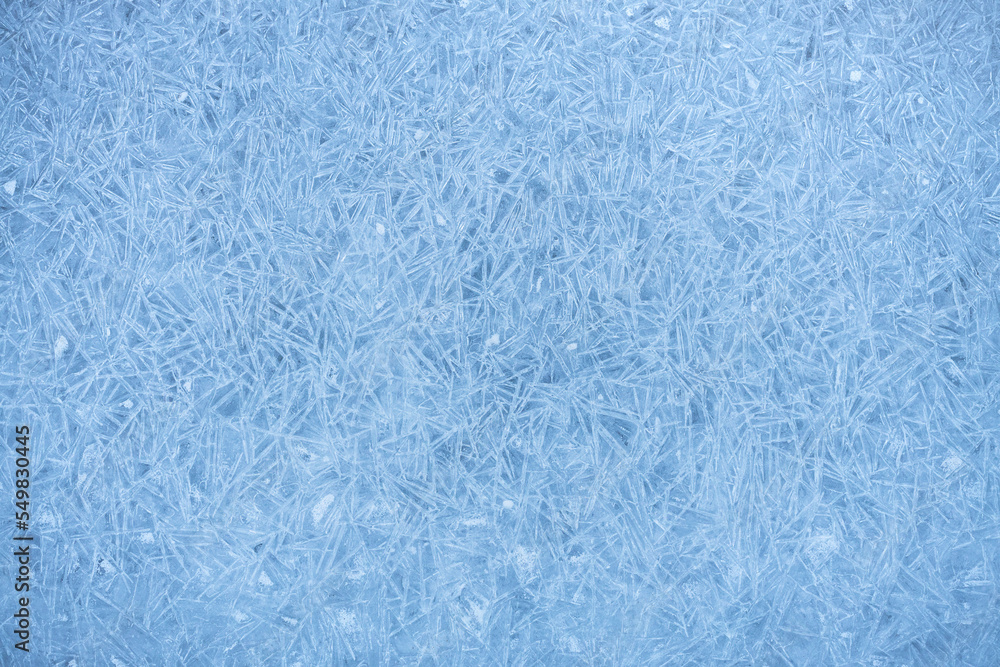 Frosty pattern on frozen ice, hoarfrost on lake ice, winter abstract background Frosty pattern on frozen ice, hoarfrost on lake ice, winter abstract background