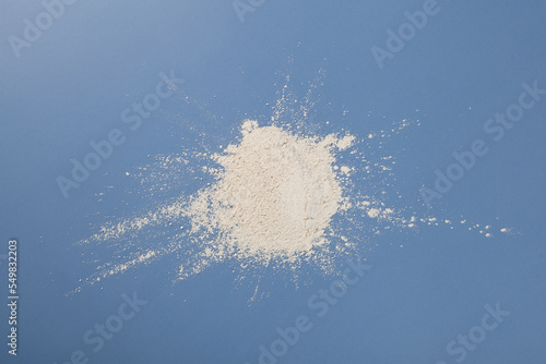 Canvastavla White chemical powder scattered on blue surface