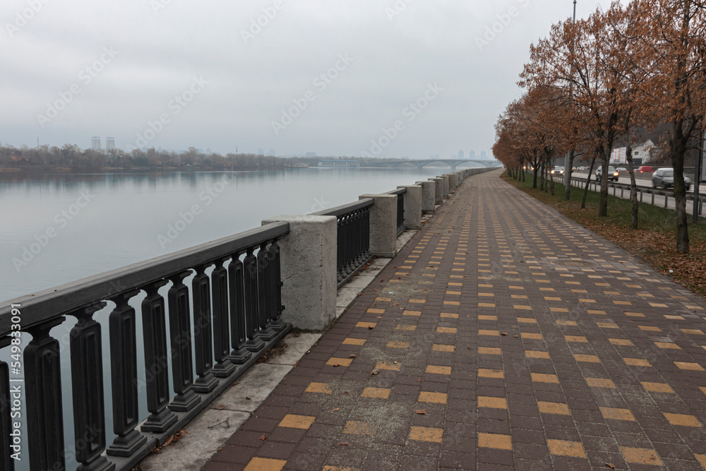 Walk at the riverside on a cloudy autumn day