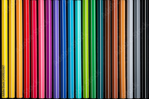 Close up of a set of colored markers. Shades of colors. Material for coloring and drawing. Objects for art lovers.