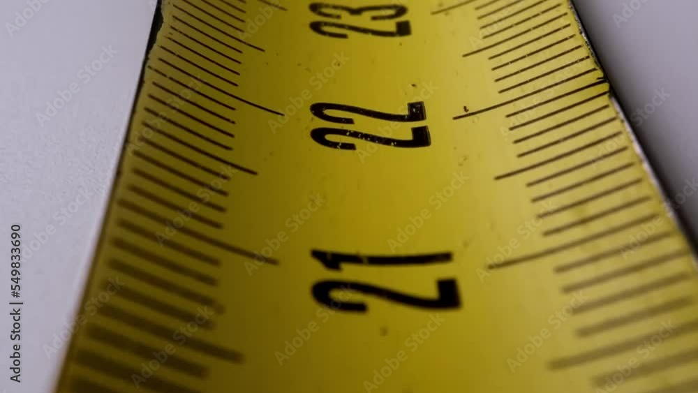 Old metal construction tape measure with a metric scale. precision measuring tool. Old metal construction tape measure with a metric scale. precision measuring tool.