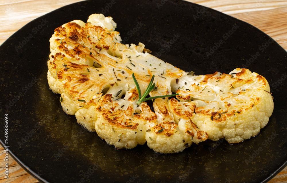 Fried Cauliflower Slices Closeup, Baked Cauliflower Steaks Fried Cauliflower Slices Closeup, Baked Cauliflower Steaks