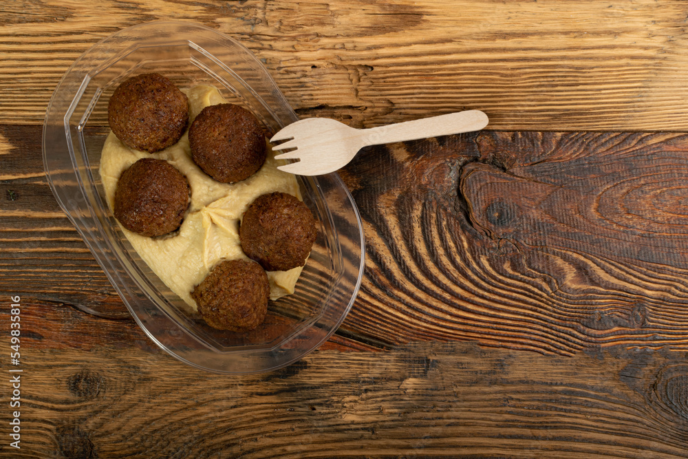 Falafel Balls in a Plastic Container, Fried Chickpea Balls, Traditional Arabic Street Food, Falafel on White Background