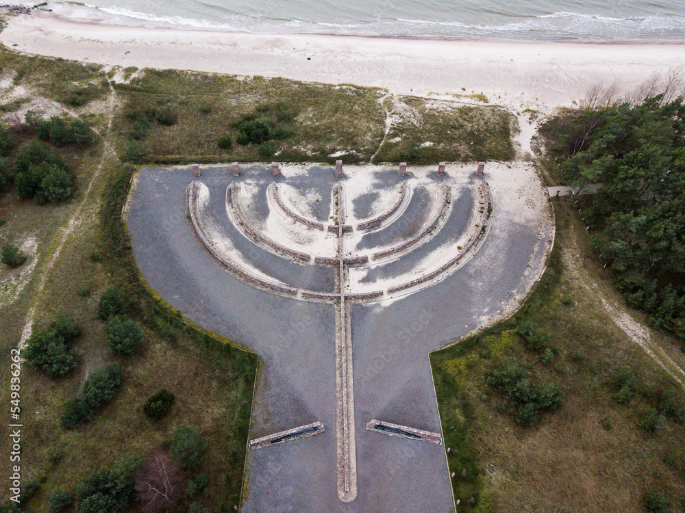 Aerial view of Memorial to the Holocaust Victims. Shape of Israel’s national symbol – the menorah or the seven-branch lampstand. Skede, Latvia.