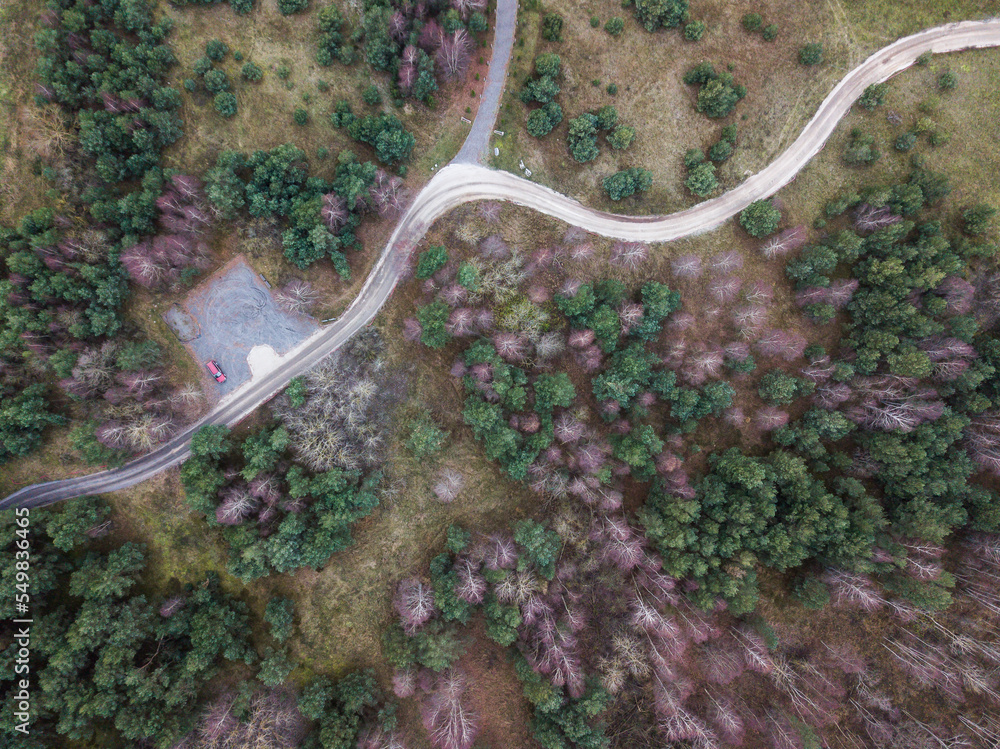 Aerial view of gravel forest road and parking lot with car, Latvia. Aerial view of gravel forest road and parking lot with car, Latvia.