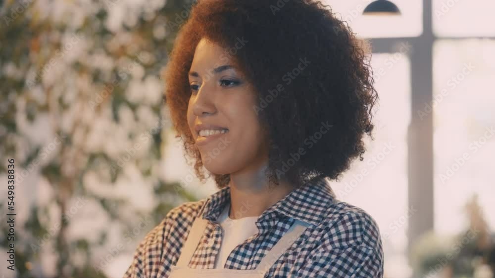 Friendly African American coffee shop employee smiling to clients, occupation Friendly African American coffee shop employee smiling to clients, occupation