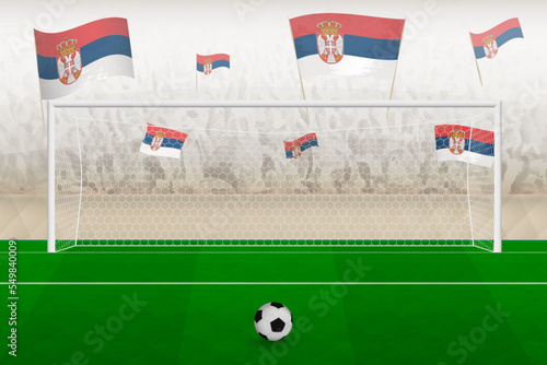 Serbia football team fans with flags of Serbia cheering on stadium, penalty kick concept in a soccer match.