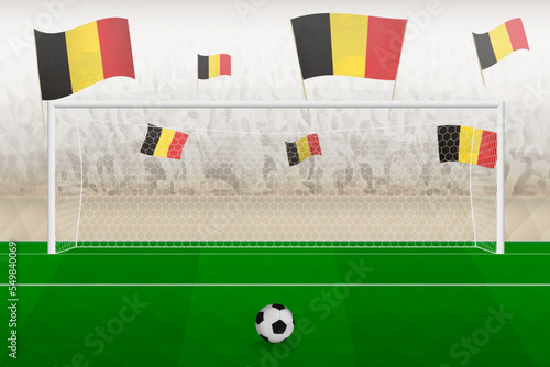 Belgium football team fans with flags of Belgium cheering on stadium, penalty kick concept in a soccer match.