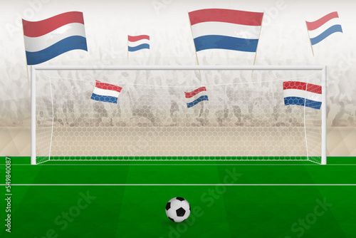 Netherlands football team fans with flags of Netherlands cheering on stadium, penalty kick concept in a soccer match.