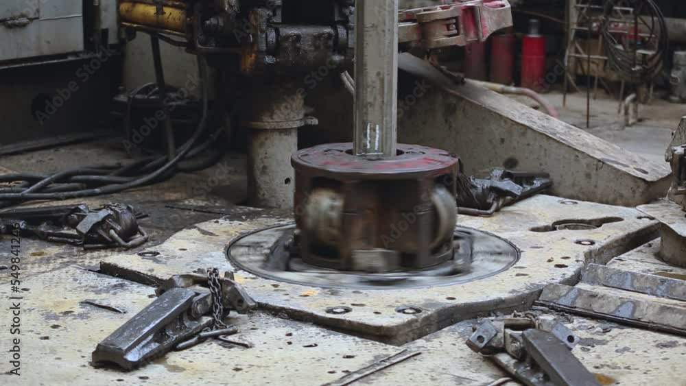Close-up of the gas and oil well drilling process. Drilling casing on a rotating table with a slipway Close-up of the gas and oil well drilling process. Drilling casing on a rotating table with a slipway