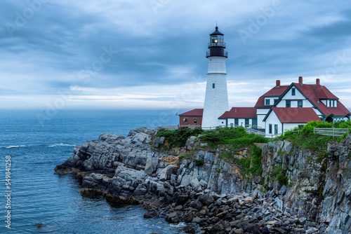 Portland Head Lighthouse at morning with stormy dramatic sky in Cape Elizabeth, New England, Maine, USA.