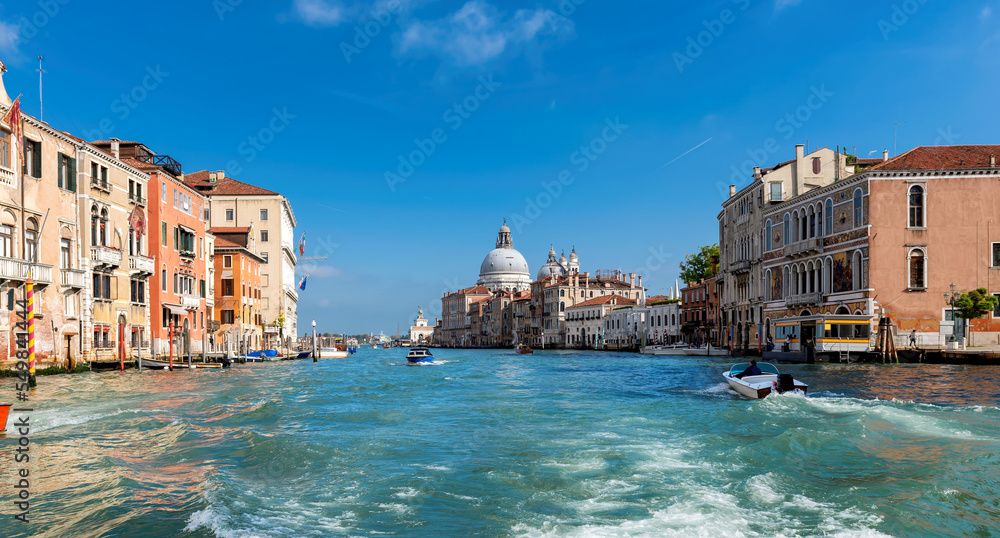 Venice skyline in sunny day. Beautiful Grand canal and Basilica Santa Maria della Salute, Venice, Italy.