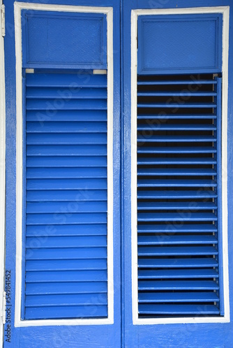 Beautiful blue wooden shutters, detail of one of the Cuban restaurants.

