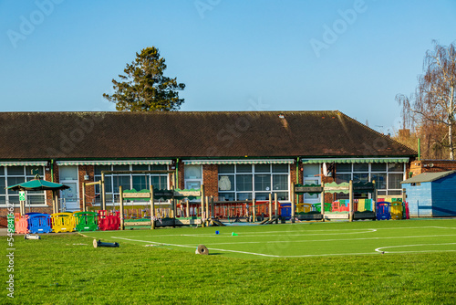 British Junior school playground & infant school playing fields on a sunny day