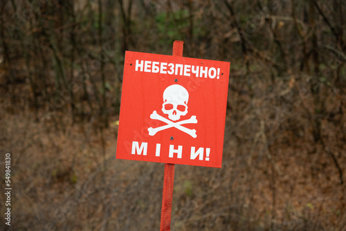Tableau sur toile Danger sign in front of minefield - Ukraine, Donbass: Danger mines