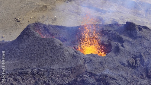 Closeup of lava erupting in a small volcano