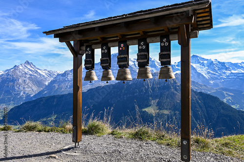 Cow bells at Schynige Platte with a view on the mountain range Eiger Moench Jungfrau