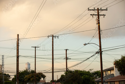 Street lights and power lines frame the historic water tower of Artesia, California, USA. photo
