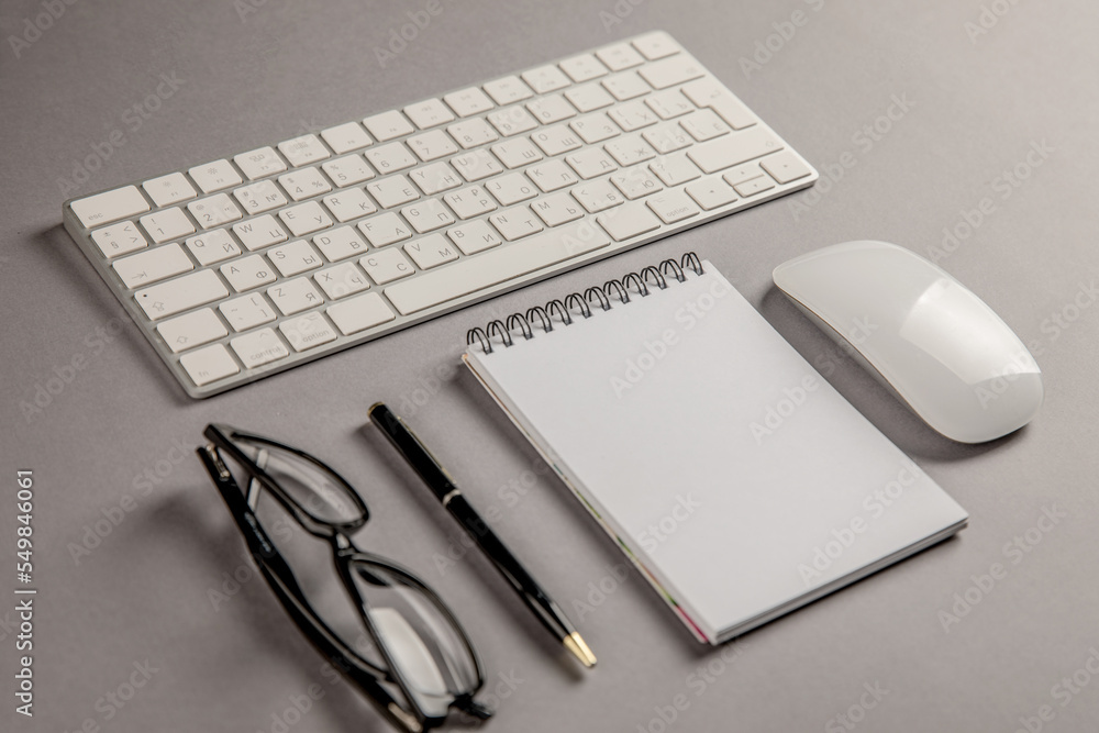 Keyboard, glasses and notepad Keyboard, glasses and notepad