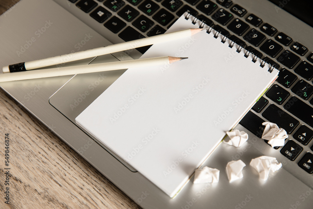Laptop, notepad and pencils Laptop, notepad and pencils